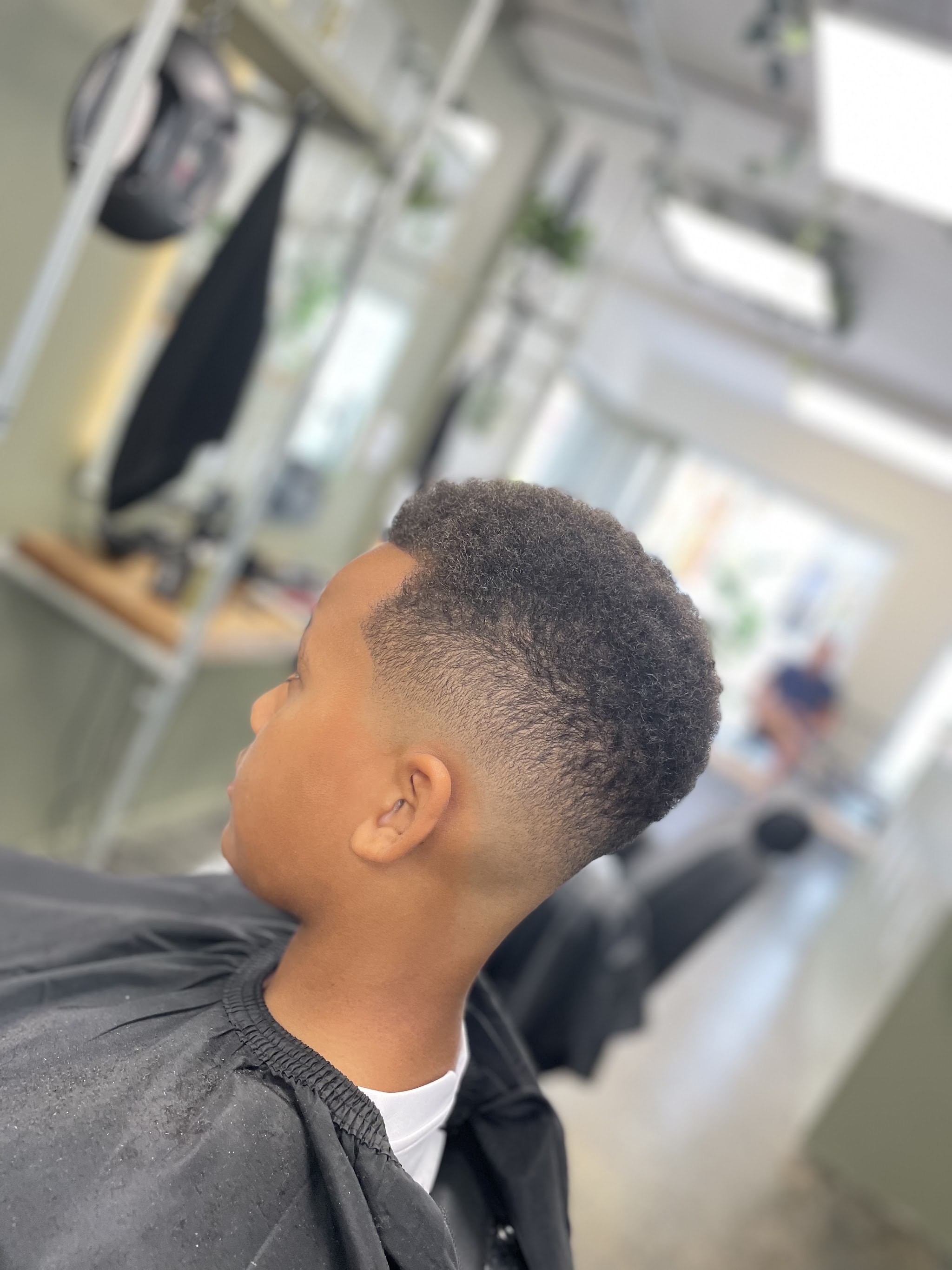 Skin fade on a young client, finished with texture on top