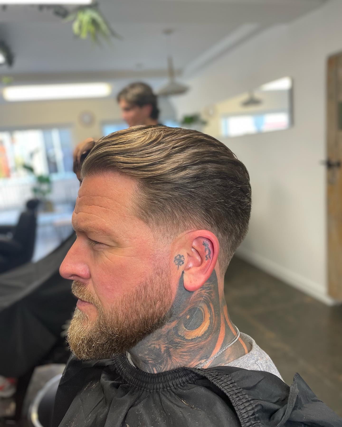 Textured slick back with a full, shaped beard